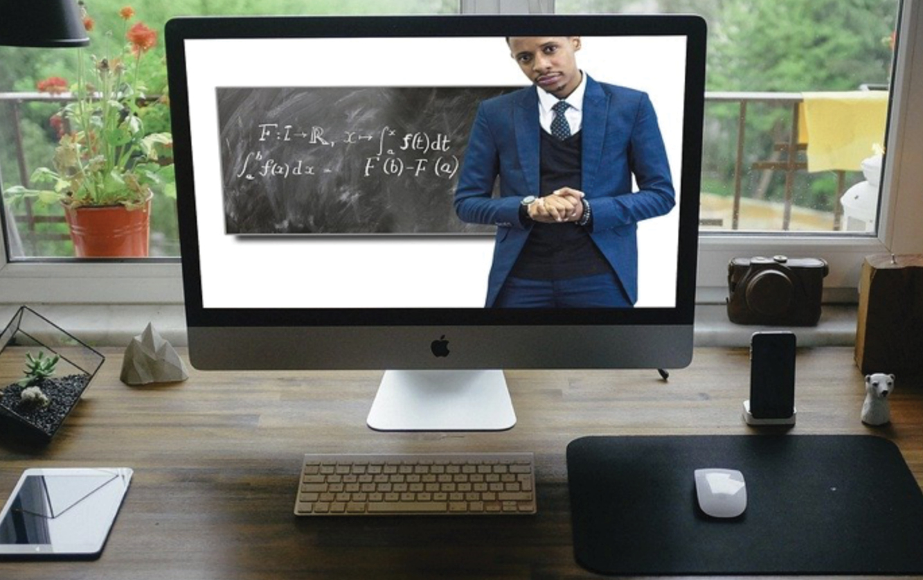 man teaching on computer screen